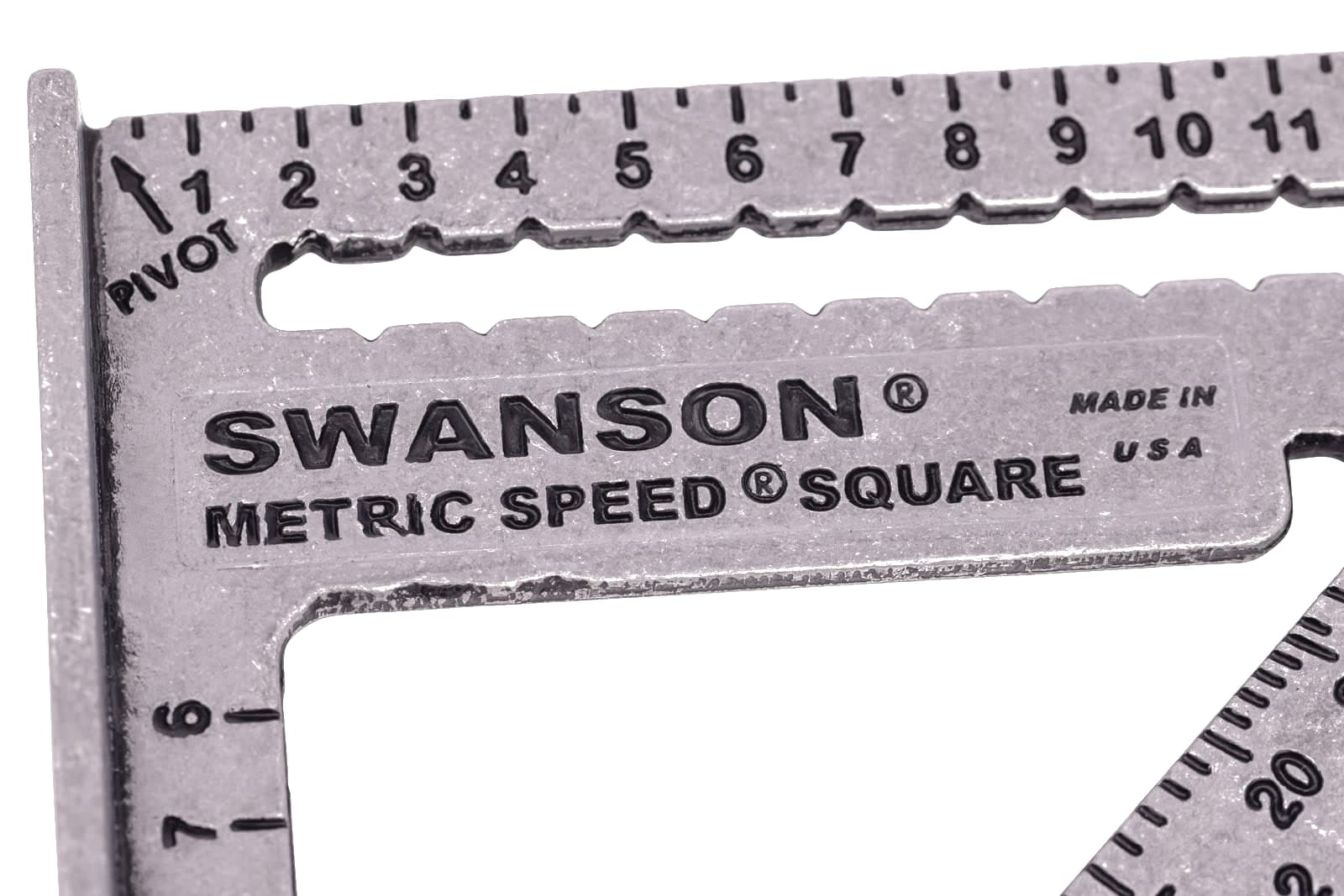Close-up of the Diamond™ cutout, protractor scale, and 0.5 cm Speed® notches on the Swanson Metric Speed® Square.