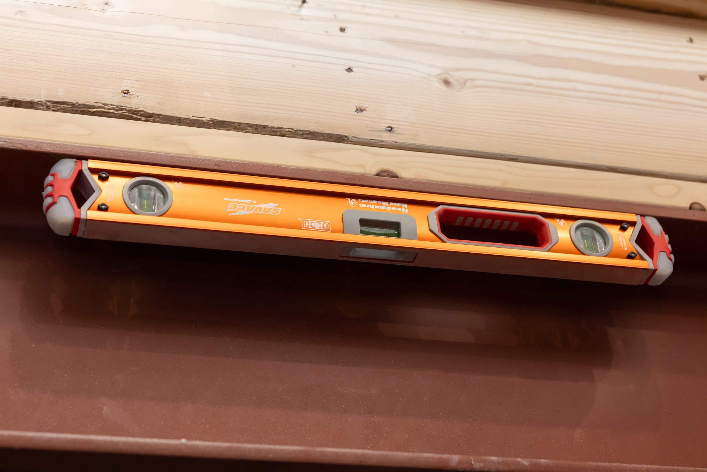 SVB24M in use on a job site, magnetic bottom edge holding to steel framing.