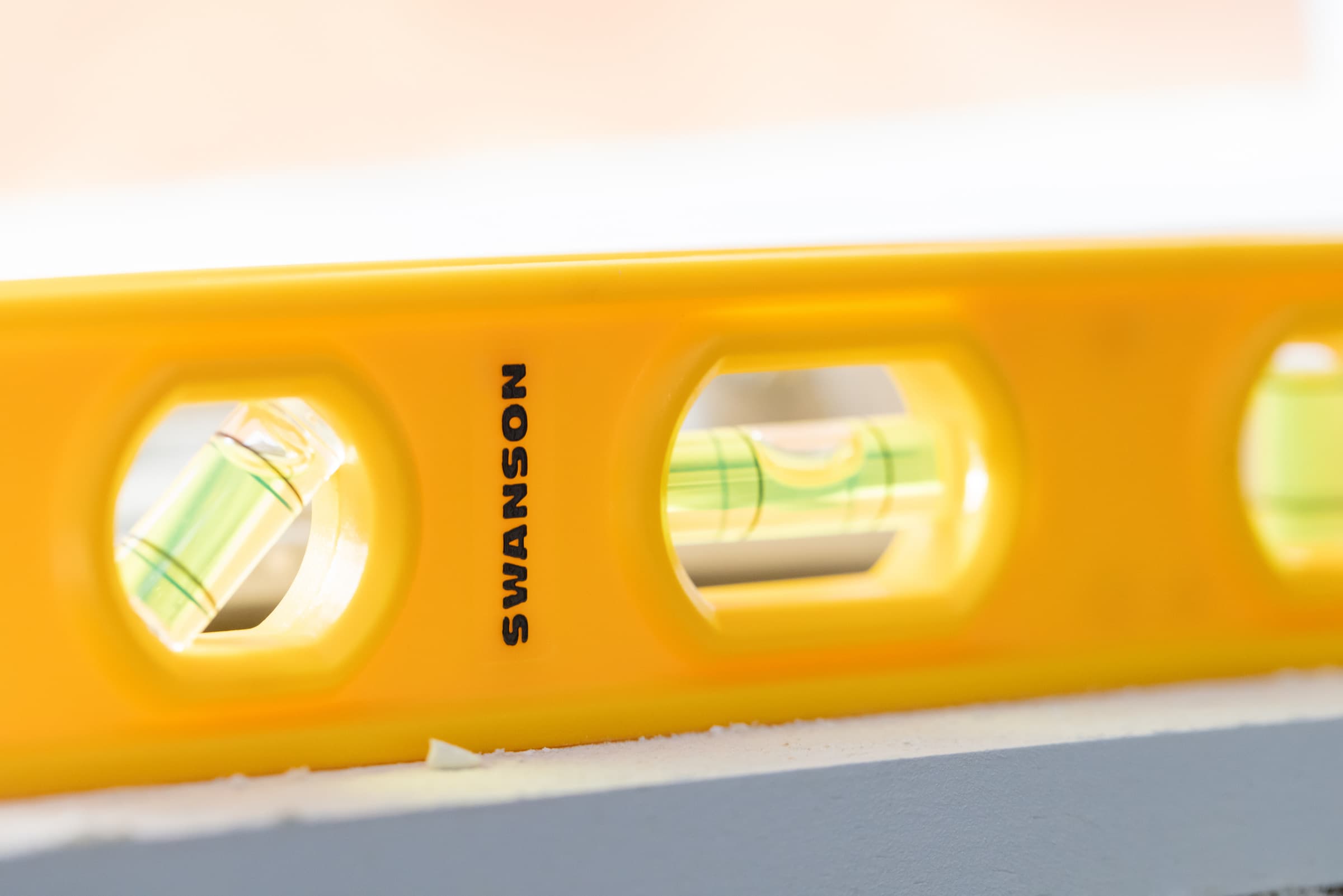 The TL011 Speedlite® torpedo level on a wood framing or job-site application.