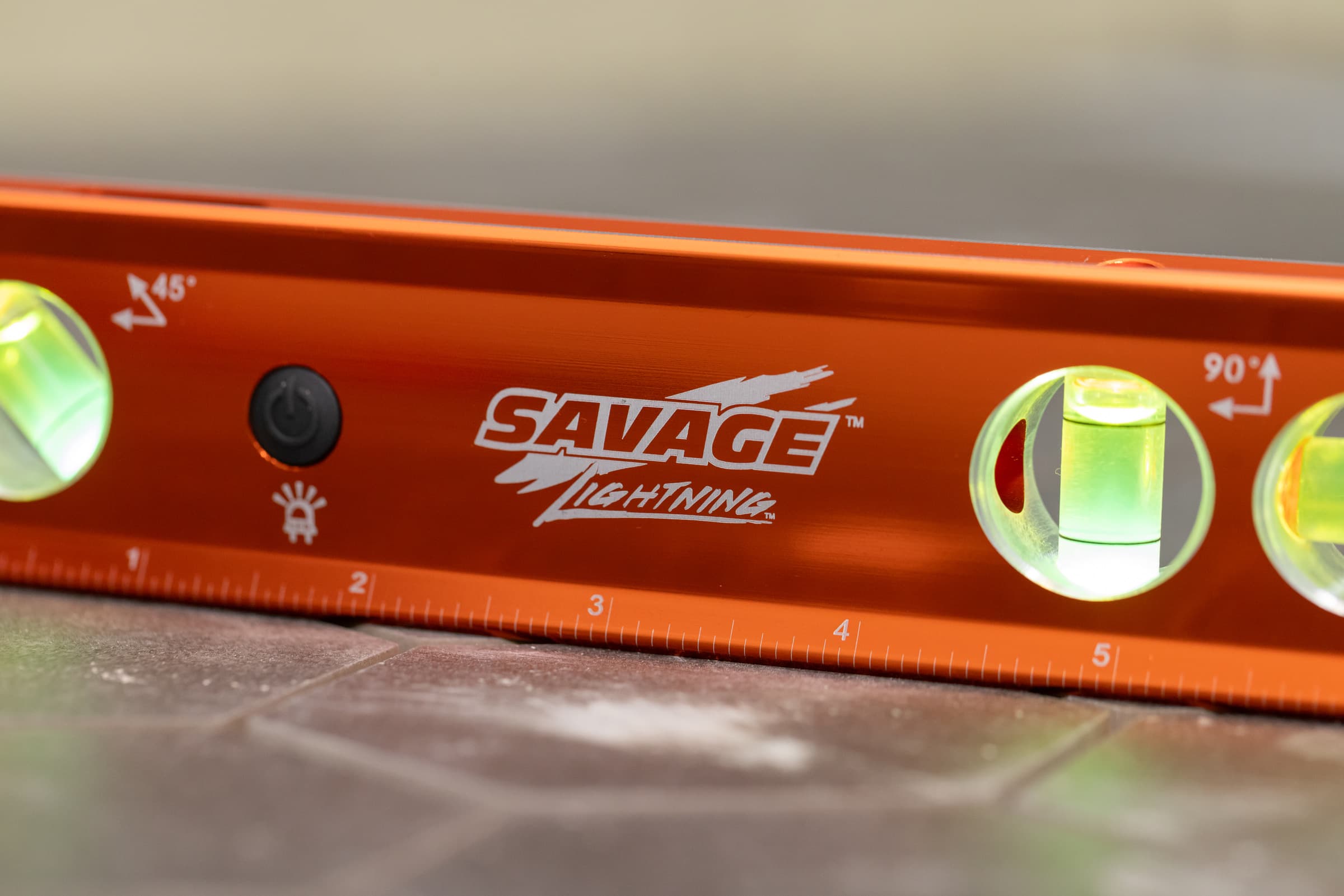 A trades pro using the Swanson Savage® 9 in. Lighted Torpedo Level on the job site.