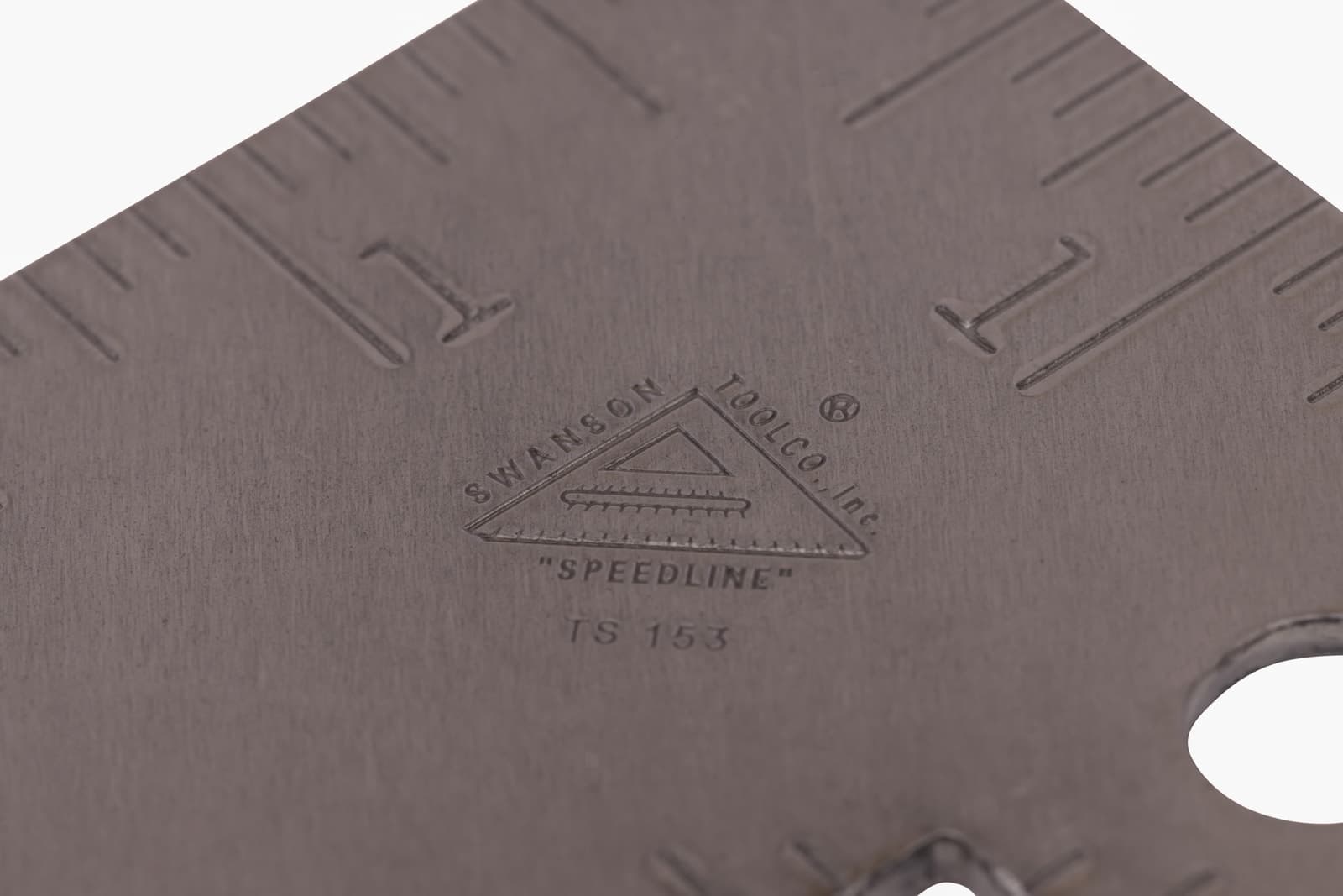 Close-up of the TS153 impressed gradations on the acid-washed steel blade.