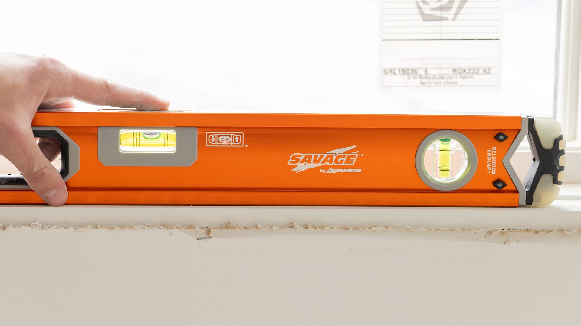 A 24-inch Savage™ Box Beam Level on a finished framing job.